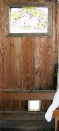 Barnboard kitchen door with stained glass