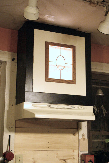 Glass cabinet over stove hood