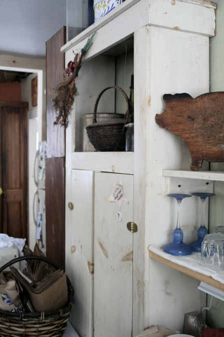 Glass cabinet holds glassware