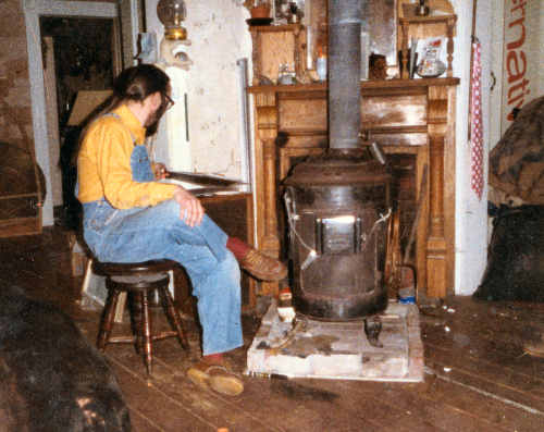 By the woodstove, ca. 1980