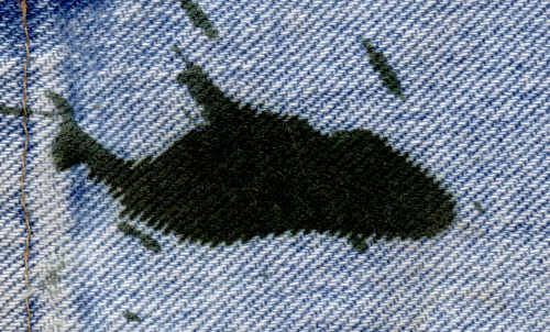 The stain on the jeans becomes a dolphin The stain on the jeans becomes a dolphin