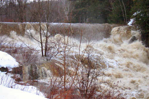 Water overtops our dam on the Cox Brook Water overtops our dam on the Cox Brook